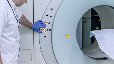 The doctor controls the MRI tool